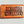 Load image into Gallery viewer, Wooden dugout with dark “MOTHER MURPHY’S” lettering on orange wood
