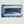 Load image into Gallery viewer, Wooden dugout with blue stripes and bold dark “SIBOOMTATS” lettering
