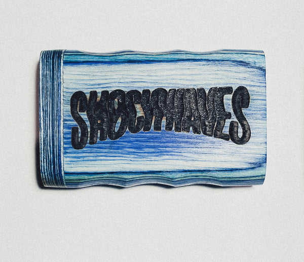 Wooden dugout with blue stripes and bold dark “SIBOOMTATS” lettering