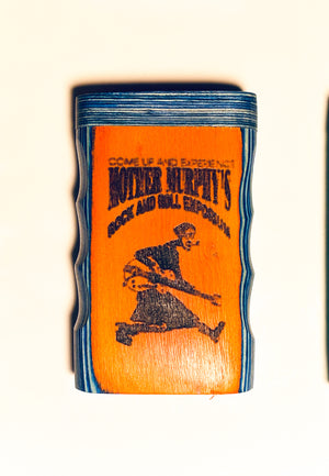 Wooden dugout with blue top and orange front featuring printed graphic art