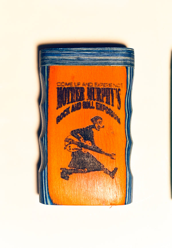 Wooden dugout with blue top and orange front featuring printed graphic art