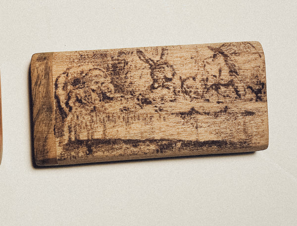 Wooden dugout with dark engraved emblem on distressed natural wood finish